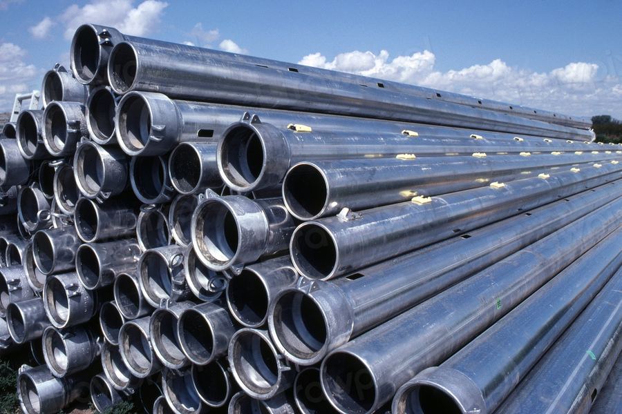 Bundled steel pipes stacked in a supply yard