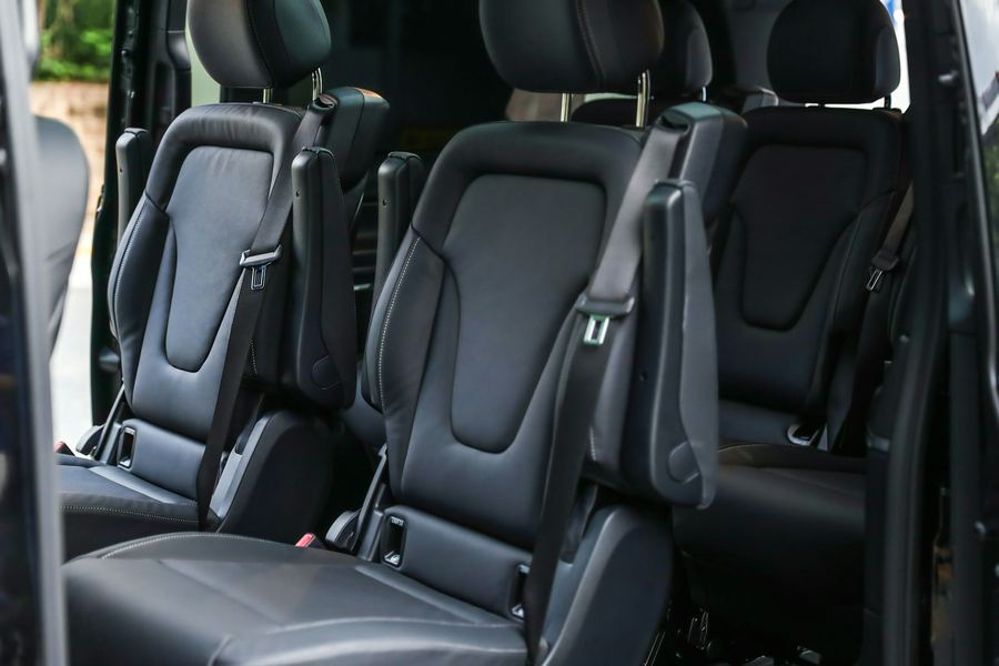 The rear cabin of an executive people-carrier, showing individual leather seats